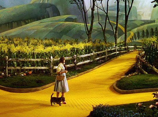 a painting of a woman and her dog walking down a yellow path in the woods