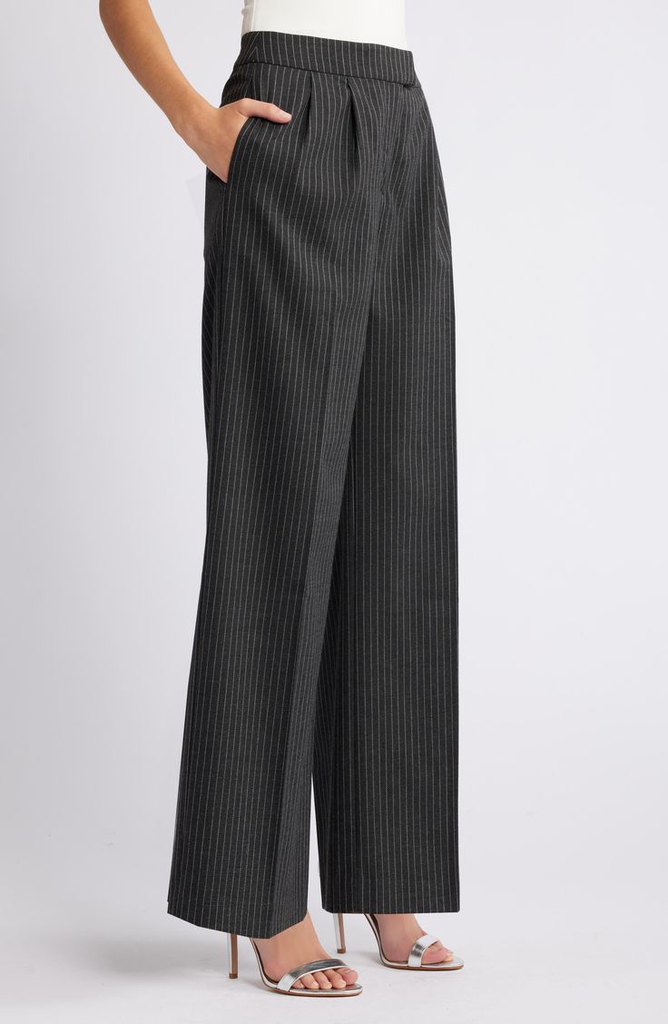 Crisp pleats structure these workday pants designed with leg-elongating vertical creases and wide legs. Zip fly with hook-and-bar closure Side-seam pockets; back welt pockets 65% polyester, 33% rayon, 2% spandex Machine wash, tumble dry Imported Elegant Pinstripe Wide Leg Pants For Business Casual, Gray Wide Leg Business Bottoms, Gray Wide Leg Business Pants, Tailored Pinstripe Wide Leg Pants For Formal Occasions, Pinstripe Wide Leg Pants For Formal Occasions, Pinstriped Wide-leg Pants For Business Casual, Pinstripe Wide-leg Pants For Business Casual, Gray Wide Leg Full Length Pants For Formal Occasions, Gray Formal Wide Leg Full Length Pants