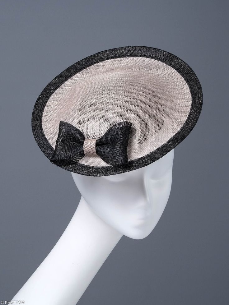 Fantastic and unique cocktail hat, made for an exceptional woman. There is a beige rim on the black base. Black trim and a simple bow are a very elegant finish. We put on the head with an elastic band. We wear it on the right side slightly in the front. It looks great with simple and classically cut clothes. * Handmade item * Fabric: beige black sinamay * Additional materials: black bow, black trim, hat diameter 10 inches * rubber * One size fits all * Worldwide shipping from Poland If you want Simple Bow, Unique Cocktails, Cut Clothes, Cocktail Hat, Black Bow, Black Trim, We Wear, Headdress, Fascinator