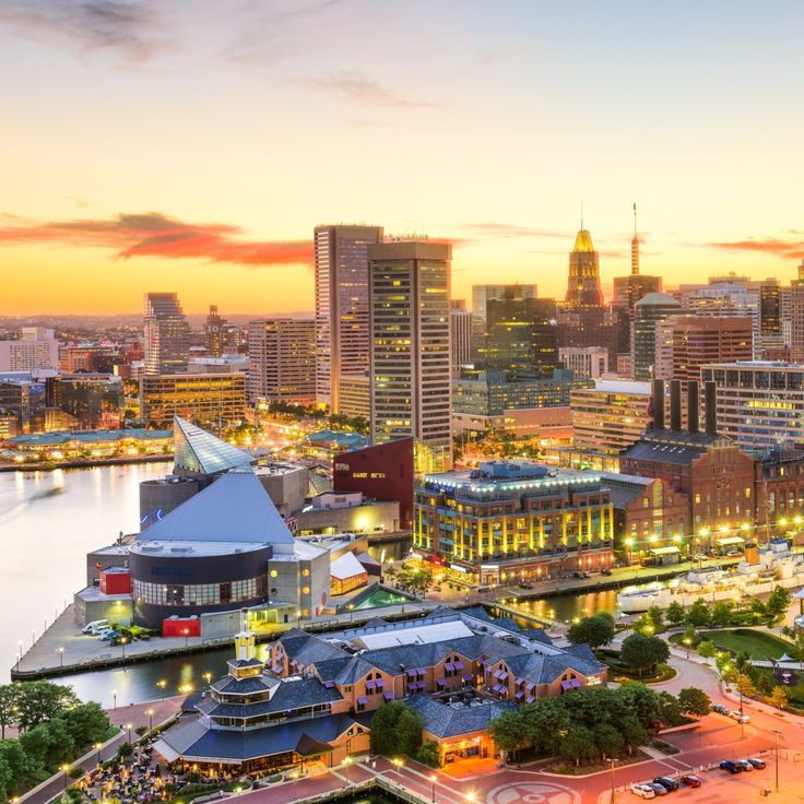 an aerial view of a city at sunset