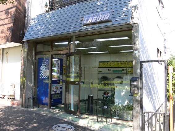 a store front with the door open on a city street