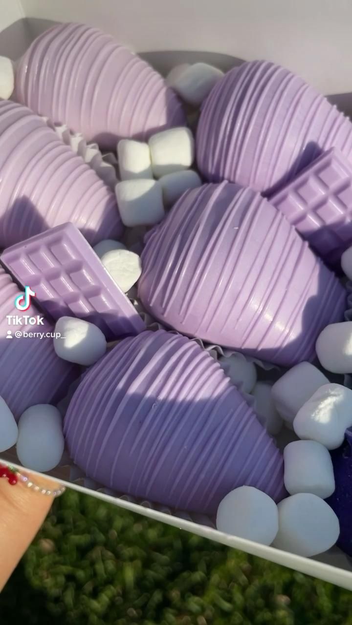 purple and white candies are in a box