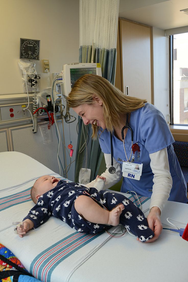 a female nurse is tending to a baby