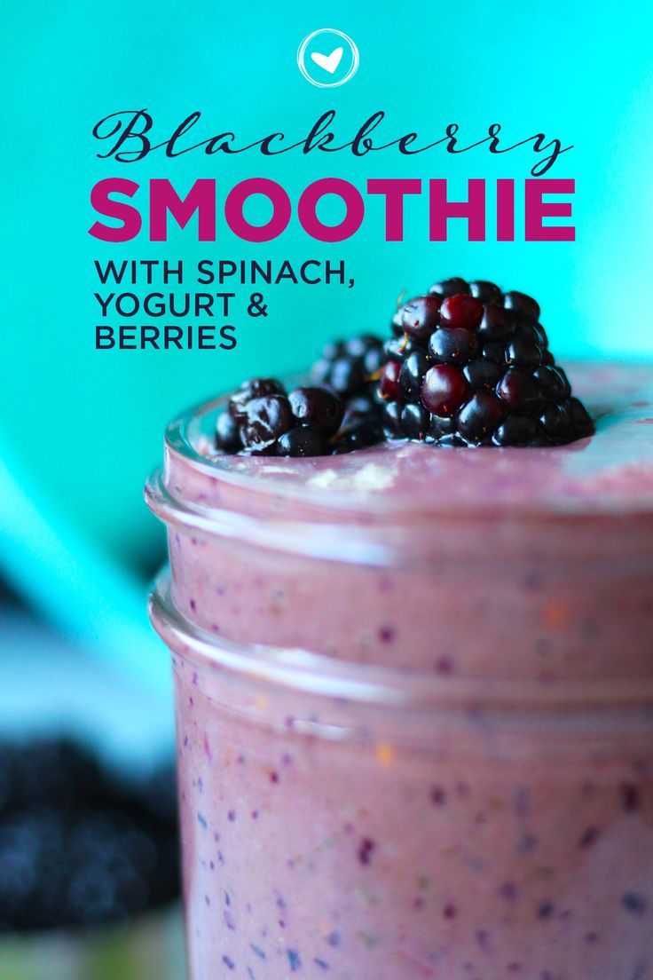 blueberry smoothie with spinach, yogurt and berries in a mason jar