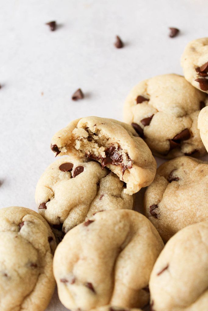 a pile of cookies that have been cut in half and are sitting on a table