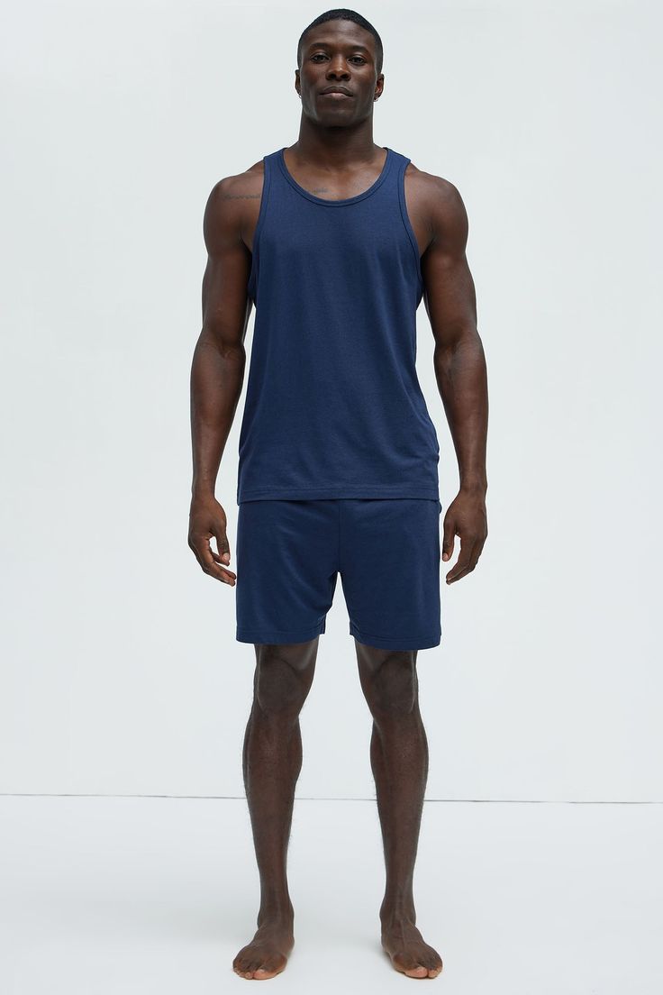 Available In Navy, Khaki, Black, Grey and Brown Scoop Neck Sleeveless 48% Cotton 47% Modal 5% Spandex Pair With "Essential Lounge Shorts" Pair With "Essential Lounge Pants" Imported | Mens Essential Modal Lounge Tank in Navy Blue size Small by Fashion Nova Navy Fashion, Lounge Shorts, Mens Essentials, Muscle Tees, Lounge Pants, Swim Shorts, Mens Tees, Black Grey, Clothes For Sale