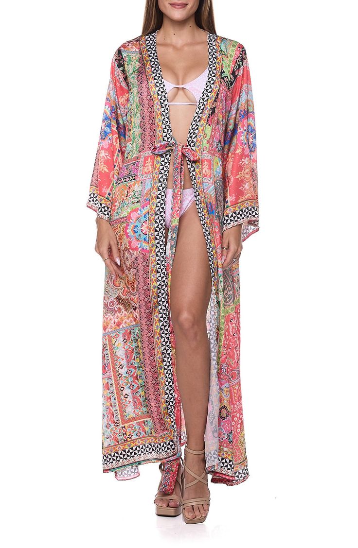 Go from beach to boardwalk in this sun-ready cover-up duster that's secured with a front tie and rendered in a bright print. Shawl collar Long sleeves Integrated waist tie
 100% polyester Hand wash, dry flat Imported Boho Print Kimono For Beach Vacation, Beach Season Boho Print Kimono For Vacation, Spring Multicolor Beach Kimono, Boho Print Beach Kimono For Beach Season, Boho Print Kimono For Beach Season, Beach Season Boho Print Kimono, Orange Beachwear Kimono For Vacation, Multicolor Open Front Kimono For Vacation, Bohemian Patterned Swimwear For Summer