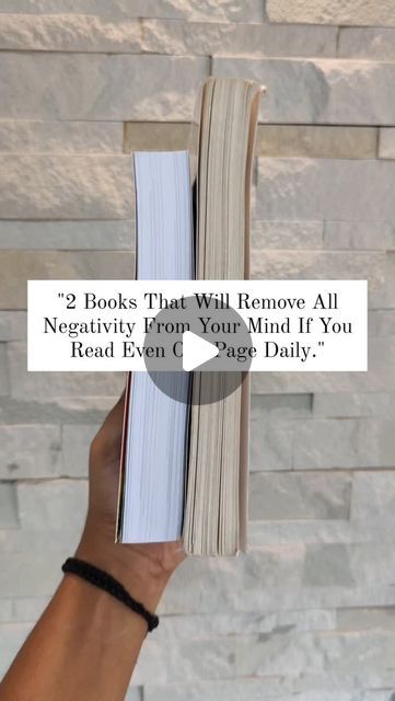 someone is holding an open book in their hand with the caption that reads, 2 books that will remove all negativeity from your mind if you read even c