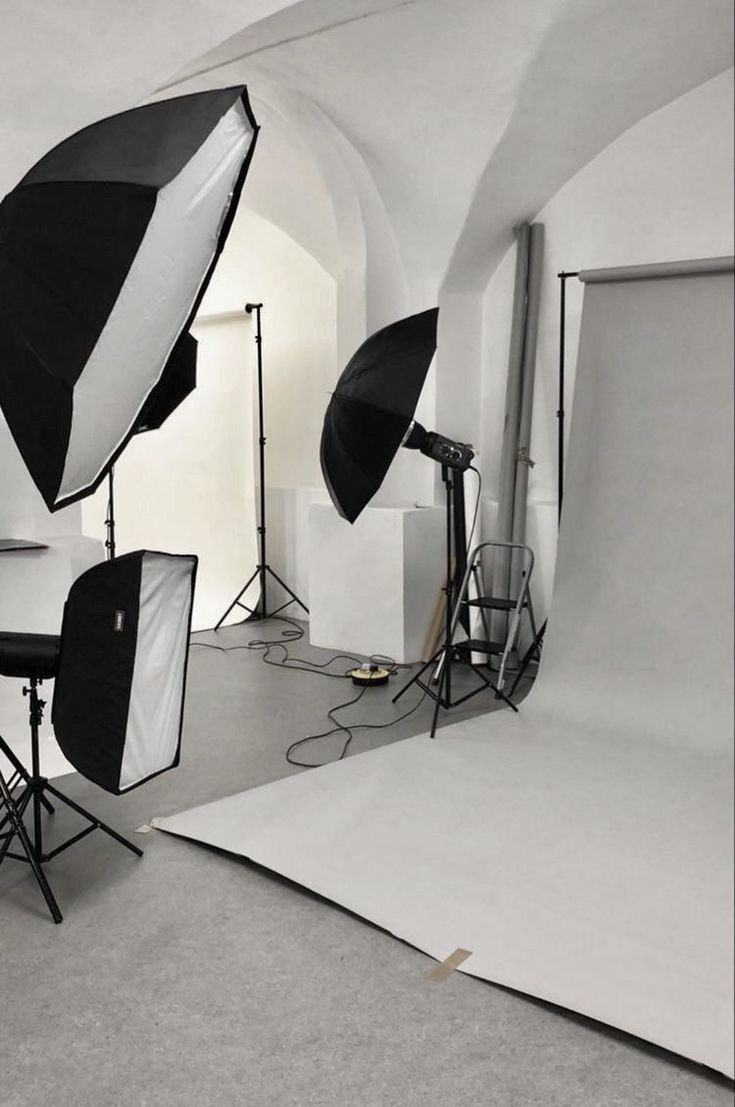 an empty studio with several lighting equipment