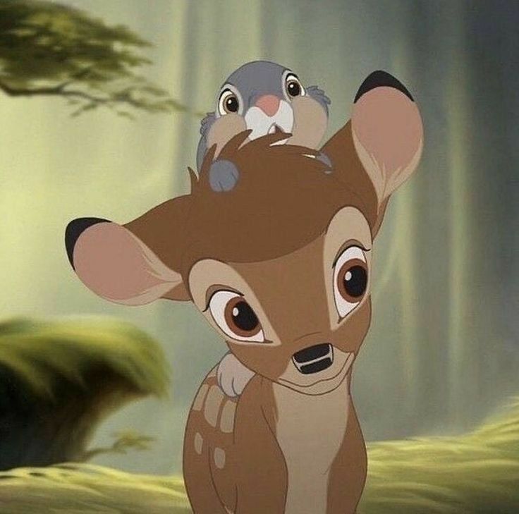 a deer and a bird sitting on top of each other