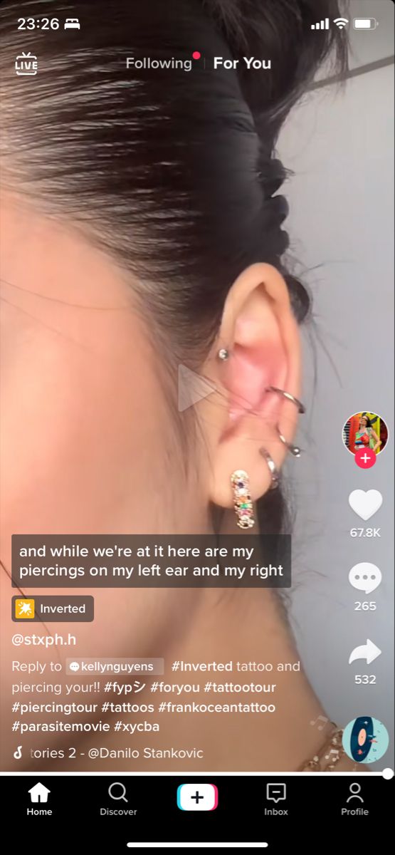 a woman with ear piercings on her ears and the caption below reads, following for you