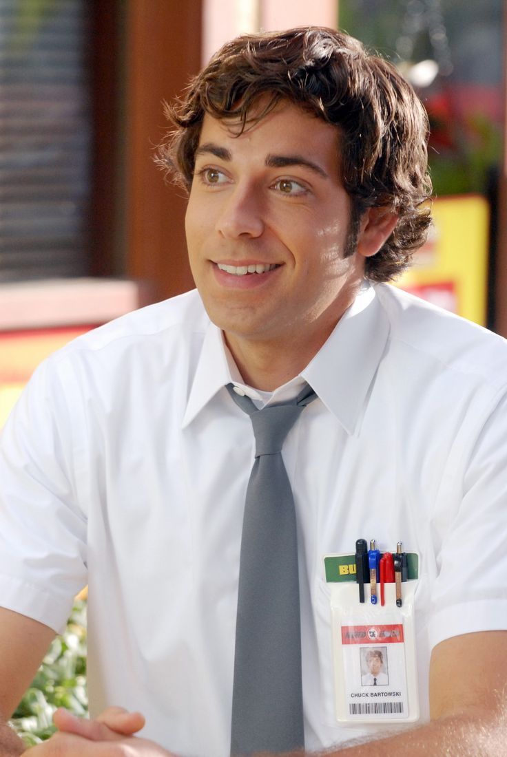 a man wearing a tie sitting at a table