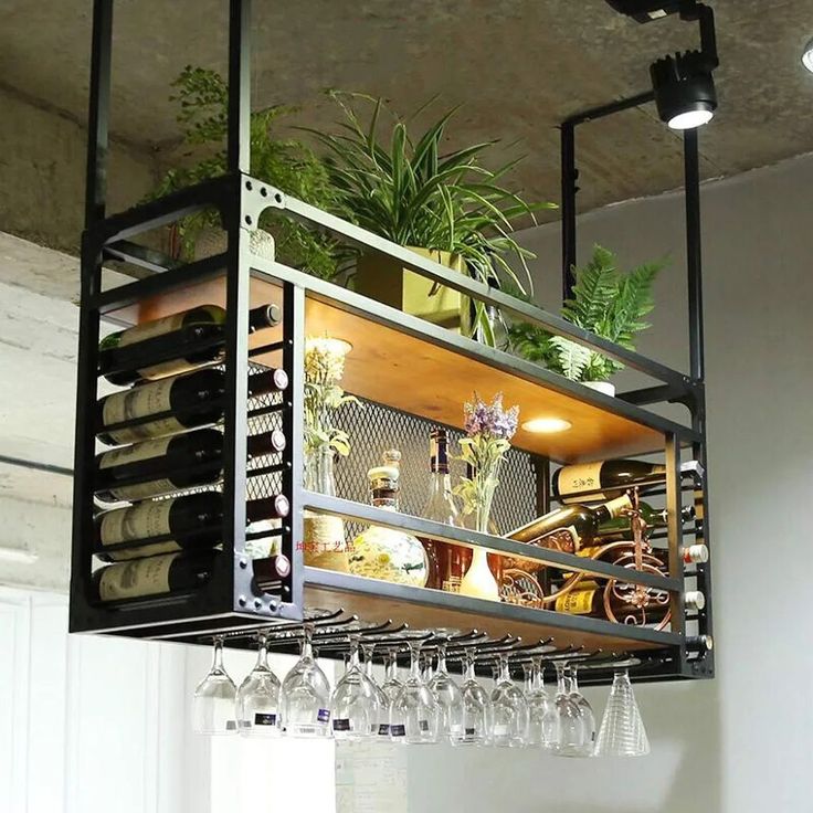 a wine rack filled with lots of bottles and glasses