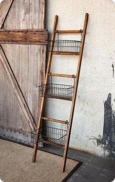 an old wooden ladder leaning against a wall