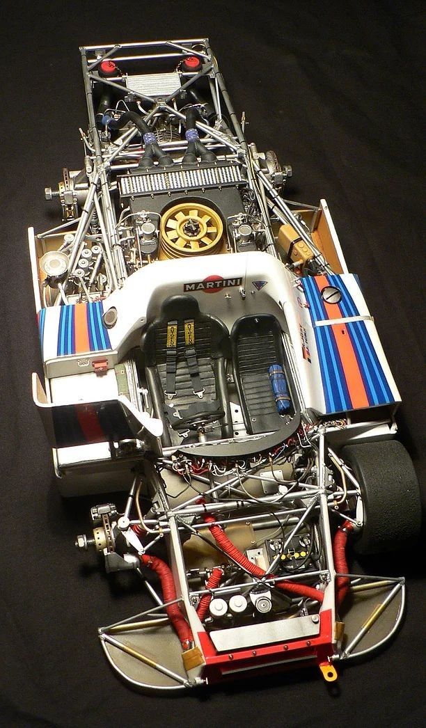 an image of a toy race car that is in the process of being built and put on display