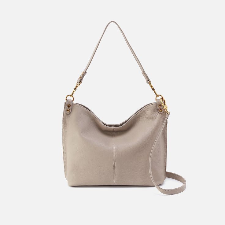 This bag pairs style and function effortlessly, converting from a shoulder bag to crossbody for two looks in one. Pier Shoulder Bag In Pebbled Leather  Taupe SHOULDER in Taupe | Hobo® Chic Everyday Shoulder Bag With Textured Leather, Versatile Hobo Bag With Textured Leather And Double Handle, Everyday Shoulder Bag With Gold-tone Hardware, Chic Textured Leather Hobo Bag For Everyday, Leather Hobo Bag With Detachable Strap For Everyday, Modern Crossbody Hobo Bag With Gold-tone Hardware, Everyday Luxury Tote Shoulder Bag, Versatile Textured Leather Hobo Bag, Everyday Tote Shoulder Bag With Gold-tone Hardware