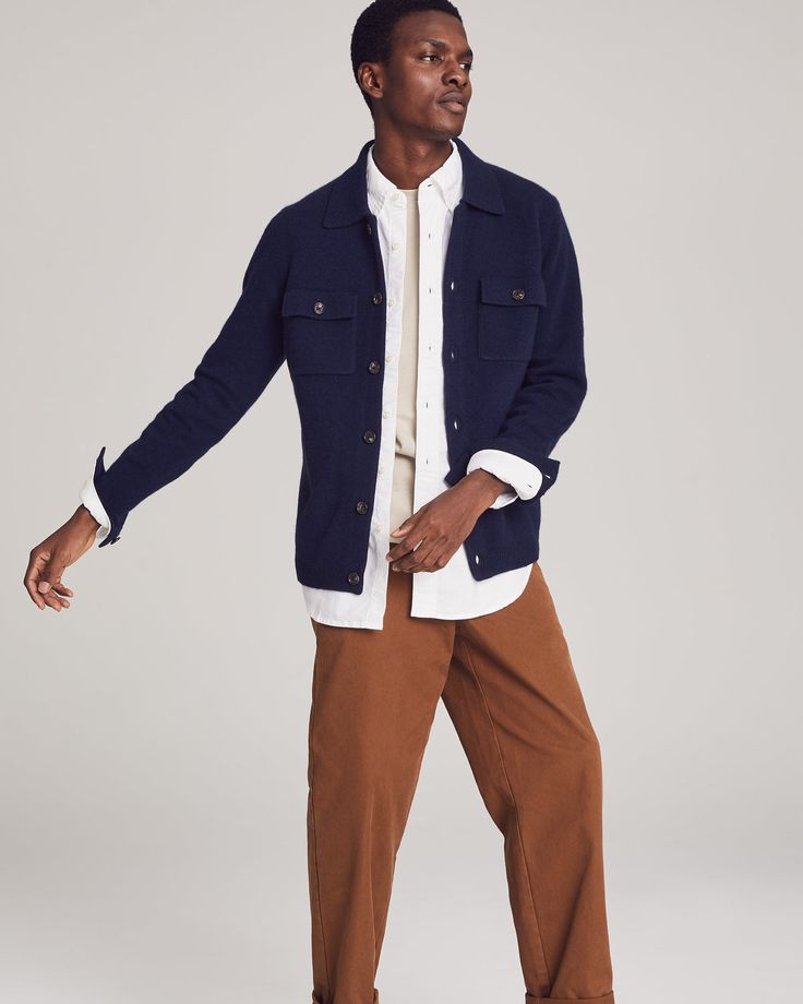 A wardrobe MVP.Crafted from luxuriously knit cashmere, this button-up shirt jacket or “shacket” features two front-flap chest pockets for a classic workwear vibe, a comfortable ribbed hem, and buttoned cuffs that allow you to roll the sleeves up or down with ease. It’s the perfect transitional piece: wear it as outerwear in spring or fall, or layer it up in winter for added warmth. Emblazoned with NOMAD1942’s insignia on the upper left sleeve, this shirt jacket proudly celebrates our New York Ci Cashmere Throw Blanket, Cashmere Clothing, Classic Workwear, Cashmere Outfits, Cashmere Throw, Womens Crewneck, Warm Jacket, Clothing Essentials, Mens Crew Neck