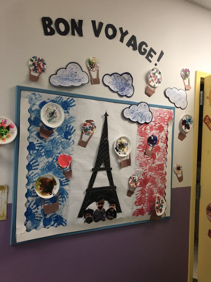 there is a wall decoration with the eiffel tower on it and other decorations