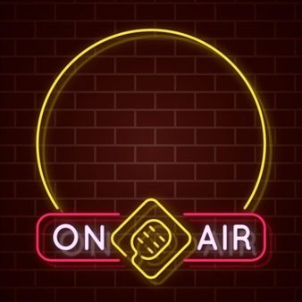 on air neon sign with brick wall and round frame in the middle, glowing yellow