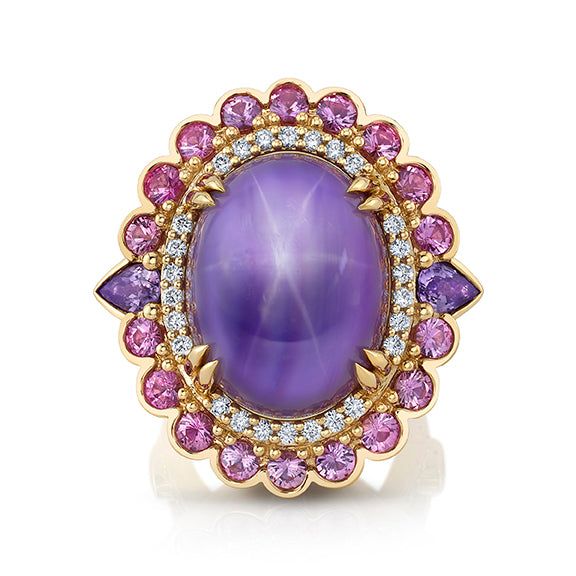 This one-of-a-kind ring is a true work of art! A rare and captivating Star Sapphire is complemented by exquisite Diamonds and shades of pink and lavender Sapphires. This ring exudes luxury, sophistication, and individuality making it a perfect symbol of unique style and refinement.18 karat yellow gold 1 Oval lavender star Sapphire, 51.57 total carat weight 18 Round pink Sapphires, 2.43 total carat weight2 Pear shaped lavender Sapphires, 1.02 total carat weight2 Oval pink Sapphires, 0.53 total ca Purple Oval Ring, Fine Jewelry Pink Sapphire Ring In Purple, Star Sapphire Ring Purple, Luxury Pink Sapphire Gemstones, Purple Amethyst Gemstones Round Shape, Luxury Purple Crystal Ring, Fine Jewelry, Star Ruby Ring, Colored Stone Rings, Gold Rings Fashion