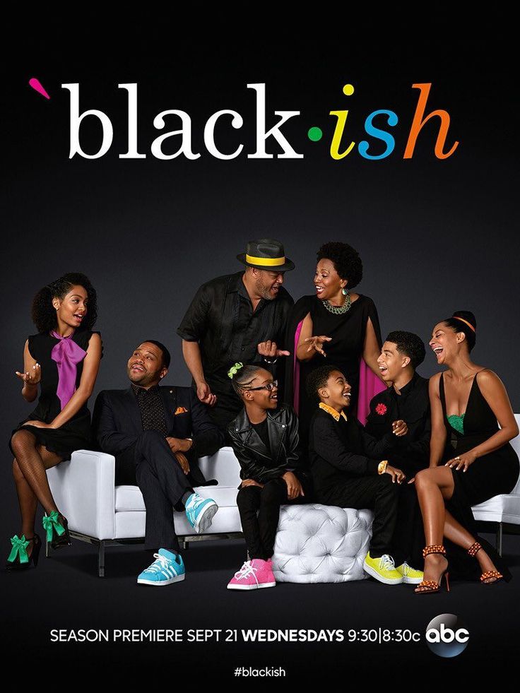 the cast of black ish sitting on a couch