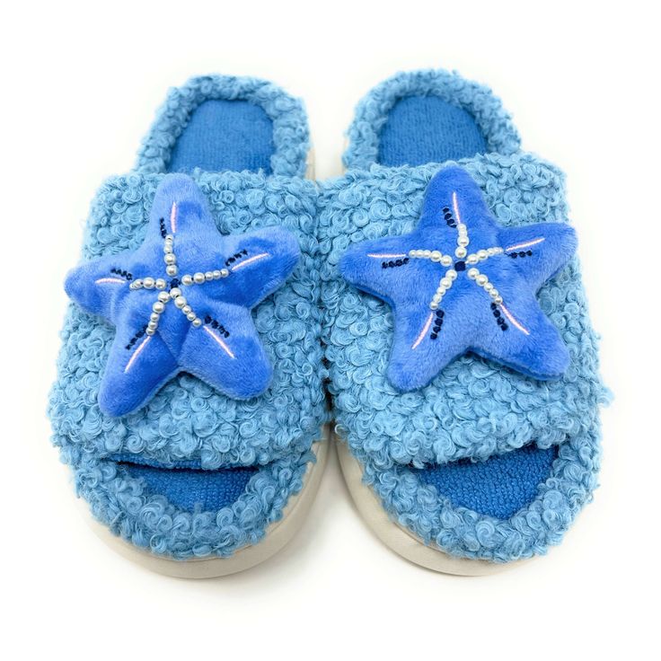 With their starfish motif and beachy vibes, these soft and cozy slides transport you to the tranquil shores with every step. Enjoy these super soft women's novelty slip-on slides from our partners at Oooh Geez! Slippers. Stay warm & look great with your new startfish themed blue fuzzy hard sole slides. Wear them around the house or out and about thanks to the non-skid rubber bottom. Pick up a pair today! Info Style: Sherpa slides with non-skid rubber bottom sole. Size: Small fits women's U.S. sh Slipper Design, Fuzzy Slides, Slides For Women, Beachy Vibes, Slide Slippers, Sock Animals, Fuzzy Slippers, Designer Slippers, Slides Women