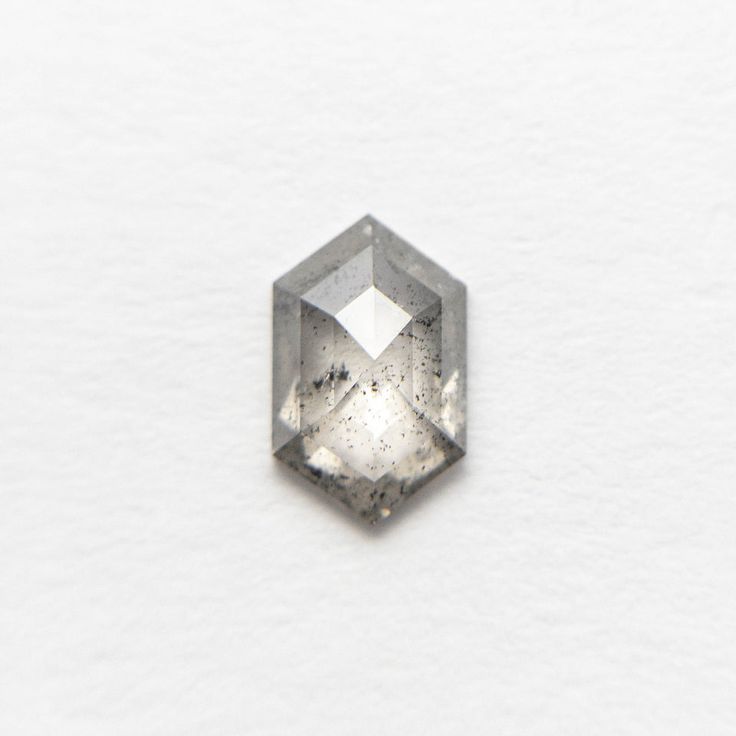 a diamond is shown on a white surface