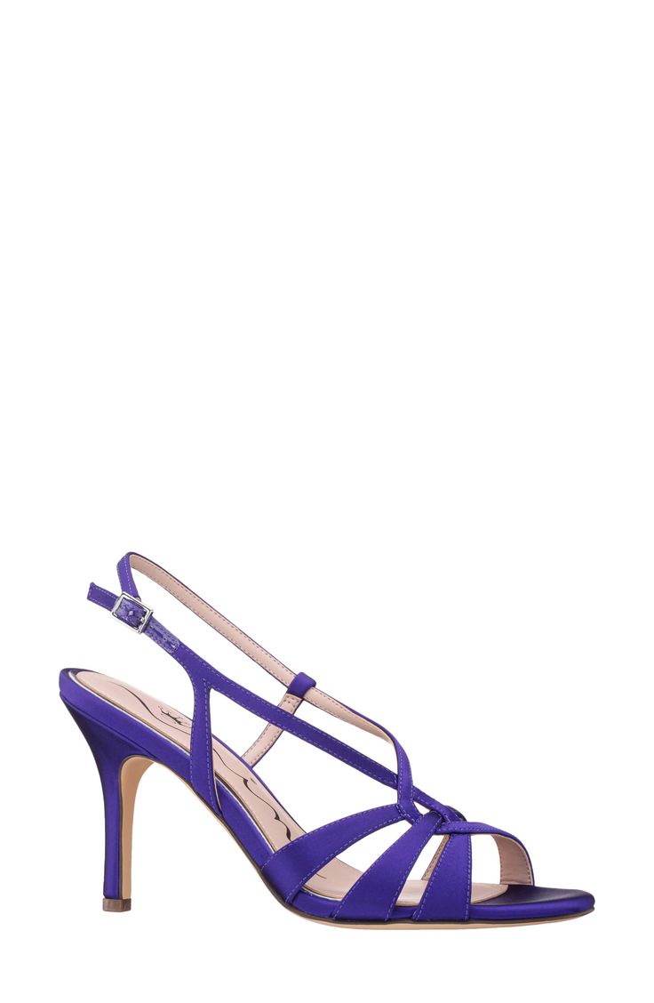 Interlocking vamp straps add visual intrigue to a slingback sandal set on a cushioned footbed and tapered heel. 3 1/2" heel Adjustable slingback strap with buckle closure Cushioned footbed Textile upper/synthetic lining/leather and synthetic sole Imported Strappy Heels For Events, Elegant Purple Strappy Heels, Strappy Heels With Heel Strap For Evening, Purple Strappy Evening Heels, Spring Evening Slingback Pumps With Adjustable Straps, Strappy Slingback Sandals With 4-inch Heel For Party, Spring Evening Heels With Straps, Spring Strappy Slingback Pumps With 4-inch Heel, Summer Party Slingback Pumps With Adjustable Straps