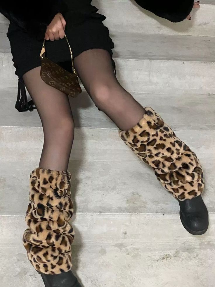 Keep your legs warm and stylish with Ngo Faux Fur Leopard Leg Warmers. Made with a soft, thick fabric, these leg warmers are perfect for the colder seasons. Don't sacrifice fashion for comfort, these one size leg warmers are part of the Alees Fashion Fall-Winter Collection. Details Ngo Faux Fur Leopard Leg Warmers Soft, warm, thick fabric One Size Alees Fashion Fall-Winter Collection Soft Thigh High Winter Legwear, Stretch Leg Warmers For Cold Weather, One Size Knee-high Winter Legwear, Trendy Mid-calf Bottoms For Winter, Knee-high Winter Legwear One Size, Trendy Mid-calf Winter Bottoms, Cozy Footless Bottoms For Winter, Cozy Footless Winter Bottoms, Knee-high Leg Warmers For Cold Weather In Fall