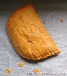 a piece of food sitting on top of a baking sheet