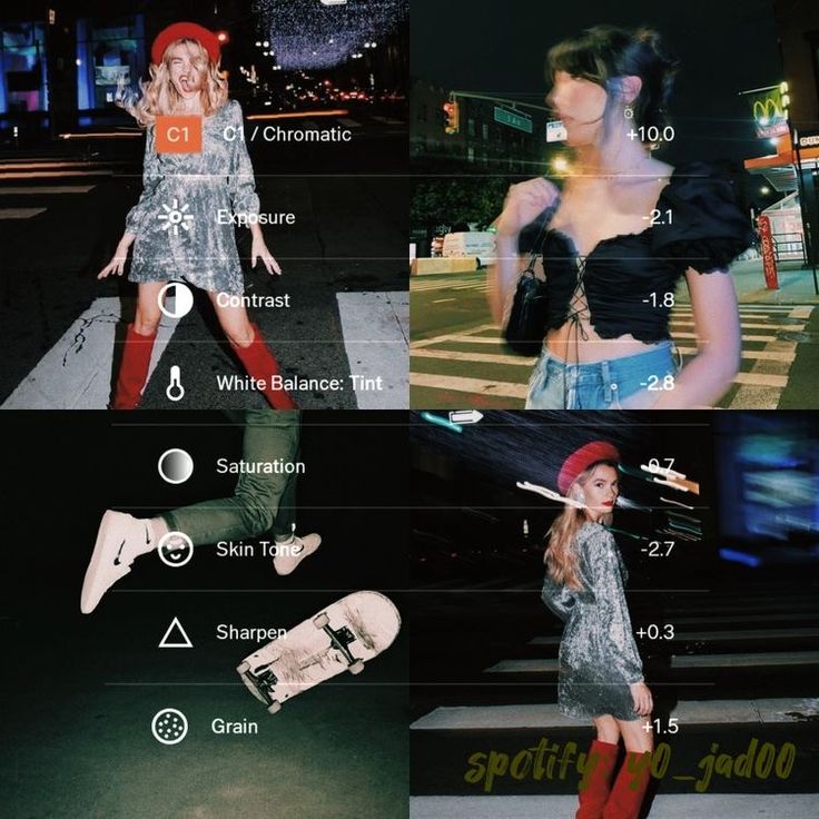 the girl is posing with her skateboard in front of some buildings and street lights