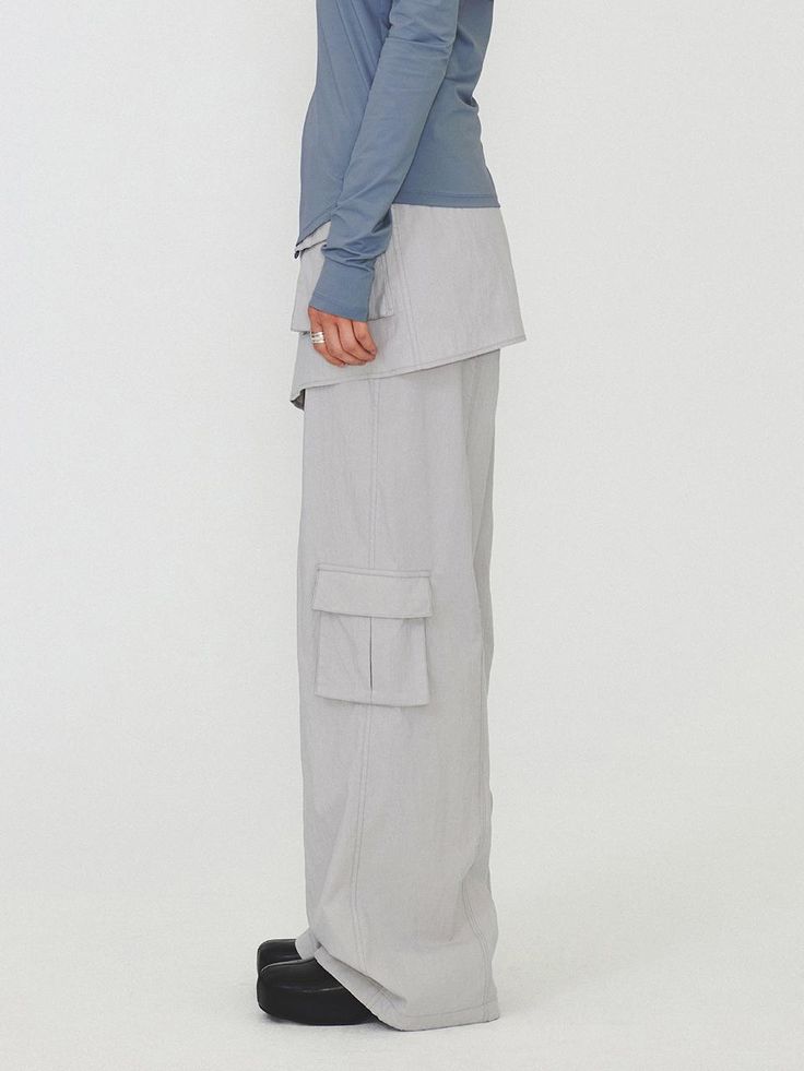 This is a modern and casual cargo pants by DIAGONAL that is made out of high quality and sturdy fabric. With unique design detail and trendy mood, you can style it for your clean and casual daily outfit.- Detachable skirt layered- Cargo pockets detail- Logo string on the hem- Logo snaps and YKK zipper Gray Utility Cargo Pants For Spring, Spring Gray Utility Cargo Pants, Gray Cargo Style Parachute Pants For Spring, Functional Cotton Cargo Pants For Spring, Spring Functional Cotton Cargo Pants, Gray Spring Cargo Pants With Multiple Pockets, Functional Gray Cargo Bottoms, Functional Gray Bottoms With Cargo Pockets, Gray Cargo Bottoms For Workwear