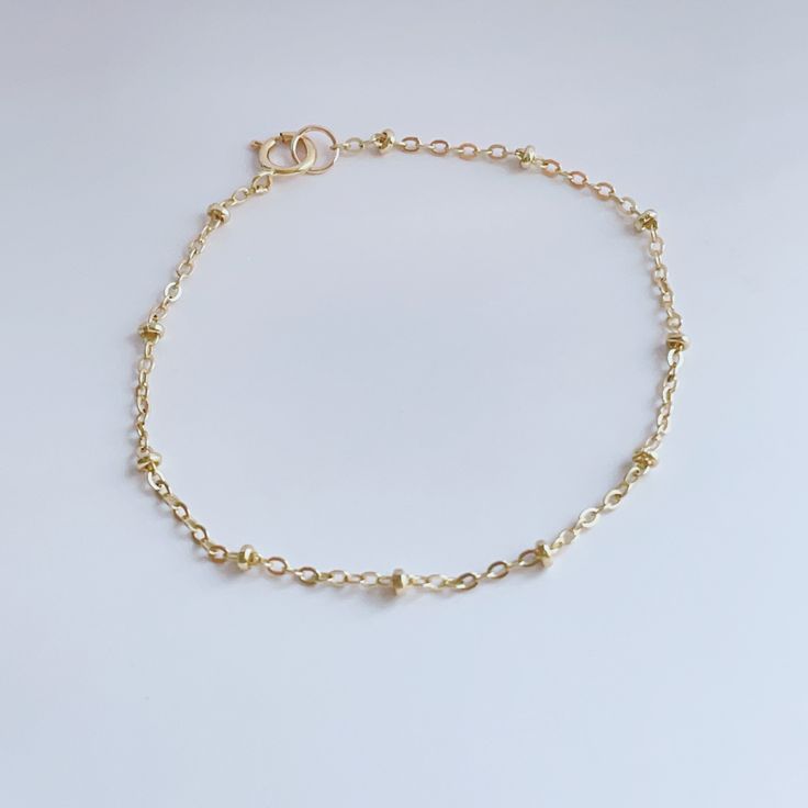 Rock everyday your satellite chain bracelet, all made with 14K gold fill that’s water resistant. Measures: 6 inch +1 in extension chain Dainty 14k Gold Bracelets With Adjustable Chain, Dainty Yellow Gold Beaded Bracelets In 14k Gold Filled, Minimalist 14k Gold Chain Bracelet With Extender, Gold Beaded Chain Bracelet In 14k Gold Filled, Dainty Gold Paperclip Bracelet With Adjustable Chain, Everyday Gold Plated Chain Bracelet With Satellite Chain, Everyday Gold Plated Satellite Chain Bracelet, Everyday 14k Gold Chain Bracelet With Extender, Elegant Gold Bracelet With Beaded Chain