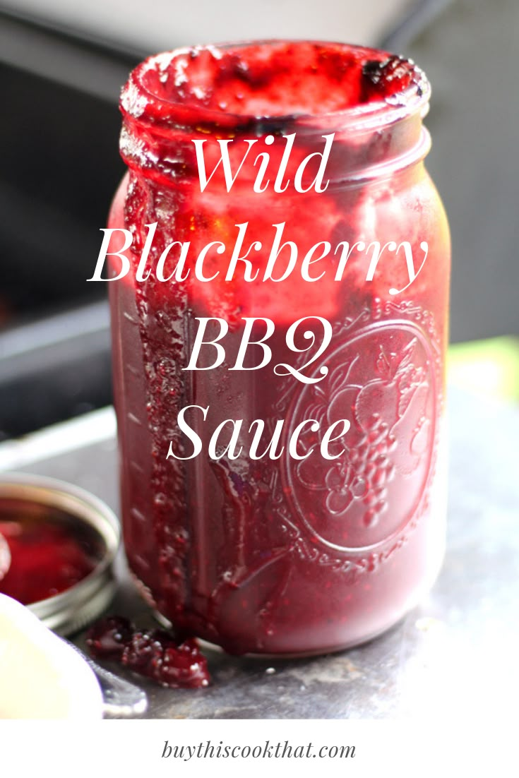 wild blackberry bbq sauce in a mason jar with the words, wild blackberry bbq sauce