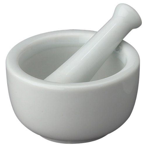 a white mortar and pestle set on a white background