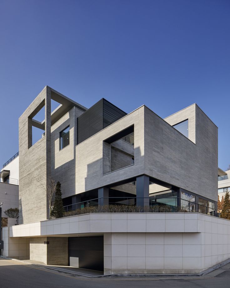 the building is made out of concrete and has two stories on each level that are connected to one another