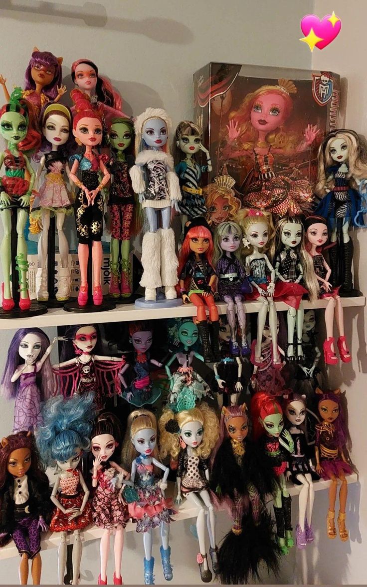 a shelf filled with lots of different types of monster dolls on top of each other