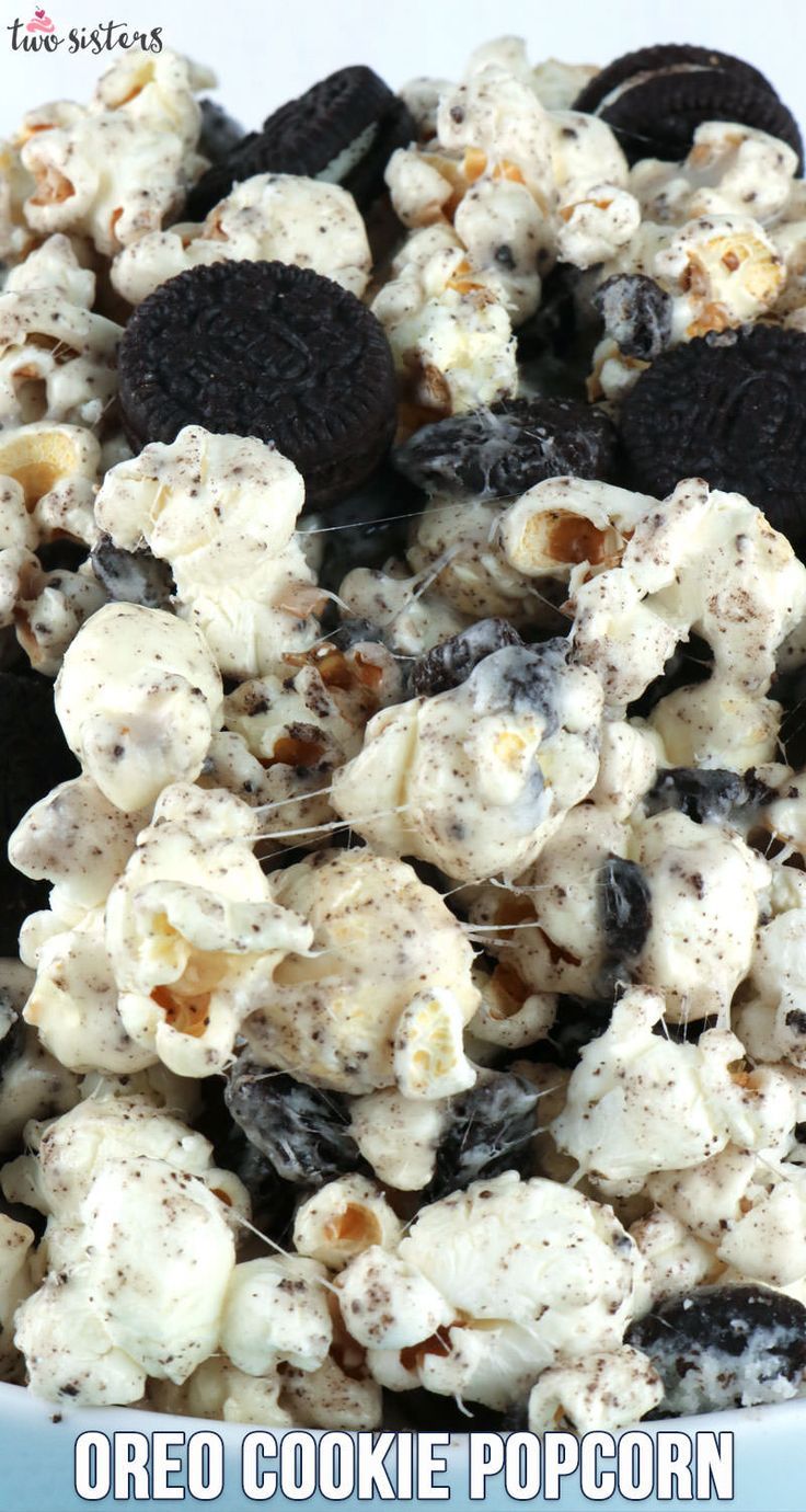 oreo cookie popcorn on a plate with oreos and cookies in the background, text overlay reads oreo cookie popcorn