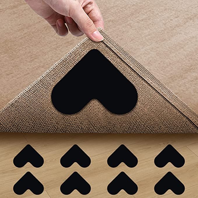 a person is cutting through the fabric on top of a piece of wood with scissors