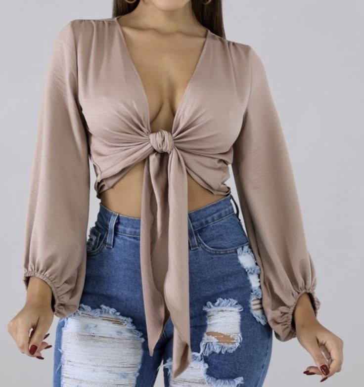 This top is perfect for your girls night, date, night, happy hour. It features a cozy stretch satin material with a ruffled elasticized end sleeve. Wear this with your perfect Jeans and make an effortless aappearance Flirty Fitted Satin Tops, Flirty Satin Top For Party, Chic Satin Tops With Ruffles, Chic Satin Ruffled Tops, Satin Ruffle Tops, Feminine Long Sleeve Satin Tops, Trendy Satin Blouse For Spring, Glamorous Satin Top For Night Out, Satin Ruffle Tops For Night Out