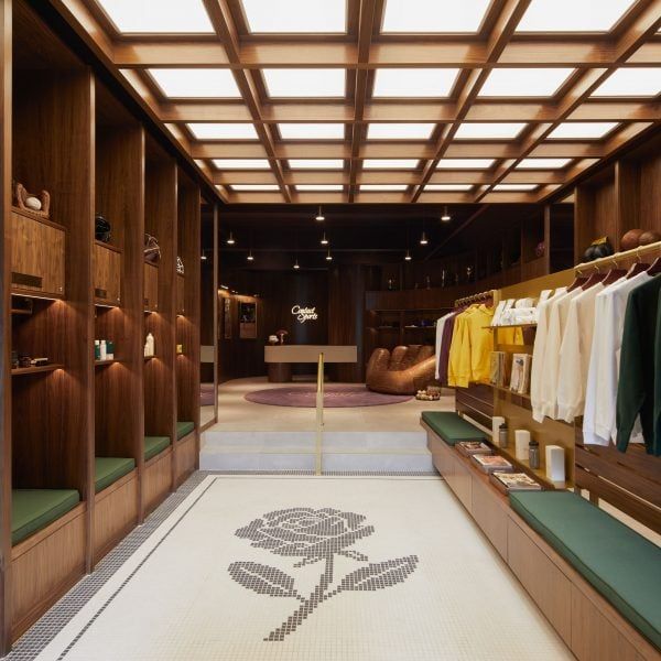 a walk in closet with wooden walls and shelves