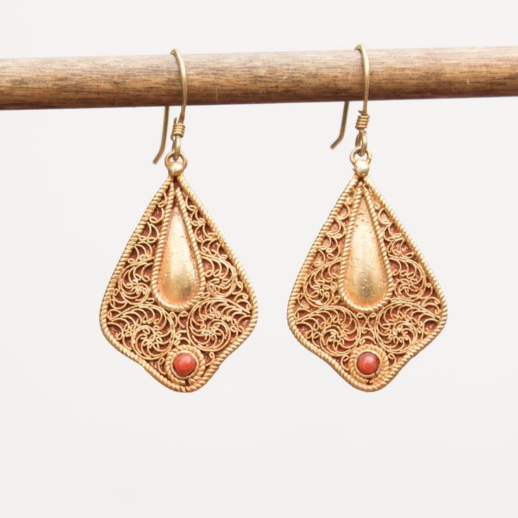 Coral set on filigree work 24k vermeil earrings Approximate dimensions; L 1.65 X W 0.75 Inches Handmade Ornate 22k Gold Jewelry, Gold Plated Filigree Dangle Jewelry, Gold Plated Filigree Teardrop Jewelry, Teardrop-shaped Gold Plated Filigree Jewelry, Ornate 22k Gold Earrings With Intricate Design, 22k Gold Filigree Jewelry As Gift, Ornate 22k Gold Jewelry Gift, 22k Gold Filigree Jewelry Gift, Bronze Filigree Jewelry