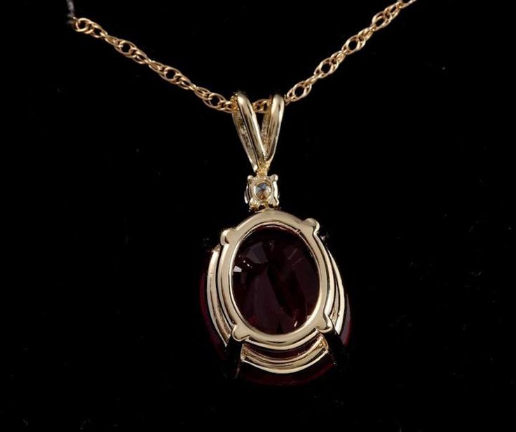 6.70Ct Natural Red Ruby and Diamond 14K Solid Yellow Gold Necklace Amazing looking piece! Stamped: 14K Suggested Replacement Value: $1600 Natural Oval Cut Ruby Weights: 6.70 Carats Ruby Measures: 12 x 10mm Total Natural Round Diamond weights: 0.05 Carats (H / SI2) Total Chain Length is 18 inches Pendant measures: 22.3 x 9.77mm Total item weight is: 3 grams Disclaimer: all weights, measurements and colors are approximate and may vary slightly from the listed dimensions or as seen in the image. Al Formal Round Cabochon Necklaces, Formal Cabochon Pendant Necklace, Exquisite Formal Gemstone Pendant, Formal Round Diamond Necklace With Gemstones, Exquisite Pendant Gemstones For Formal Occasions, Elegant Red Cabochon Jewelry, Exquisite Formal Pendant Gemstones, Formal Yellow Gold Gemstone Pendant, Oval 14k Gold Diamond Necklace For Formal Occasions