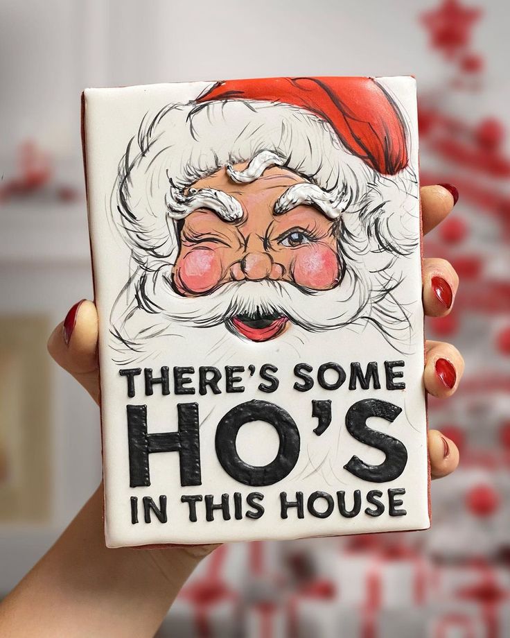 there's some ho's in this house ornament with santa clause on it