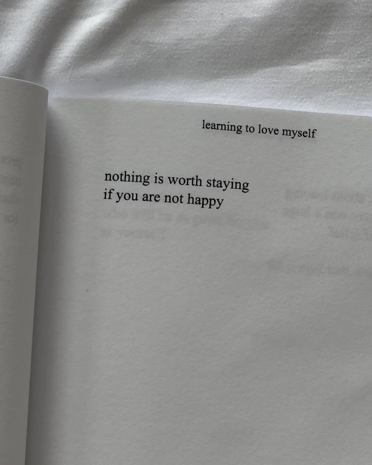 an open book with the words learning to love yourself