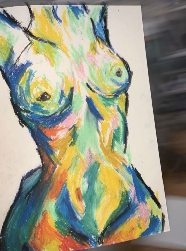 a drawing of a woman's torso is shown in this image with blurry background