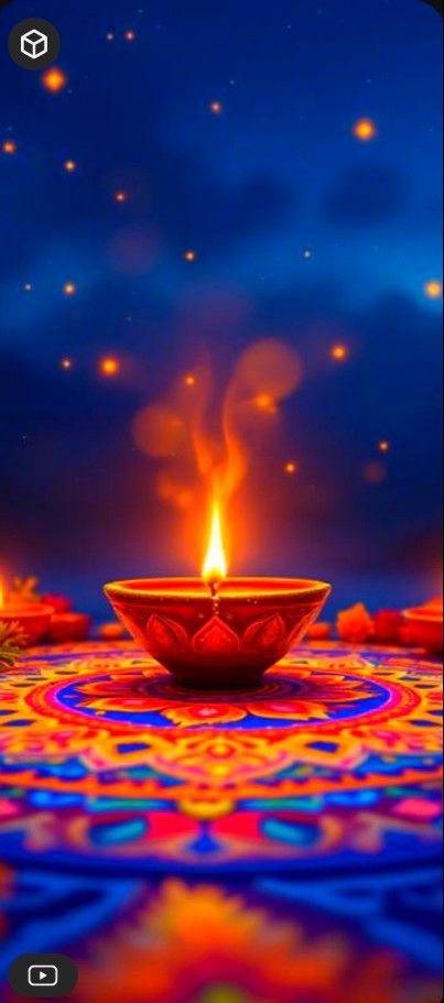 a lit diya with candles in the middle on a colorful carpet and blue sky background