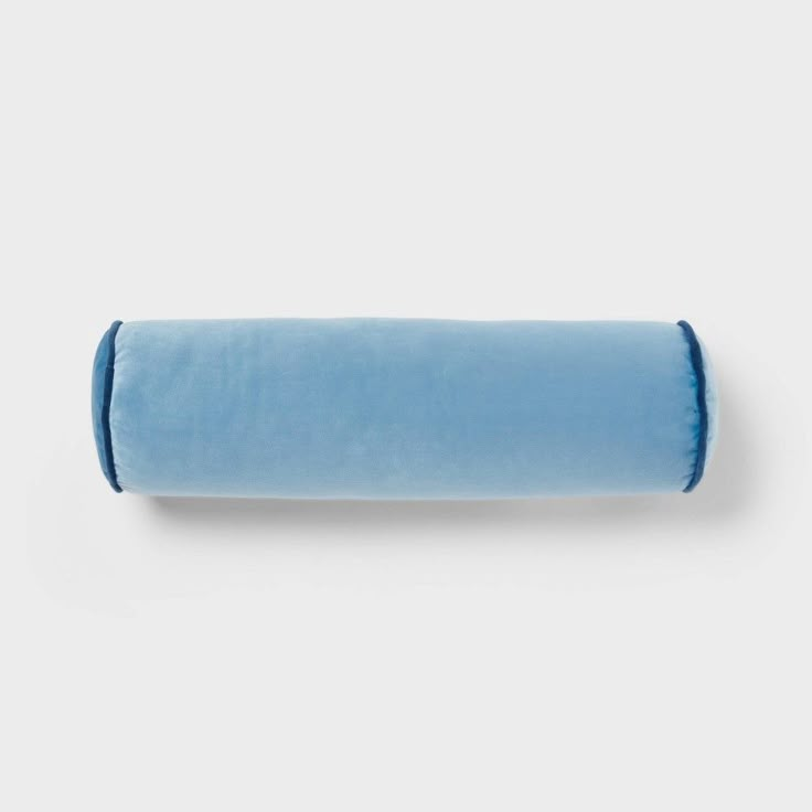 a blue rolled up pillow on a white background with the word,'i love to sleep