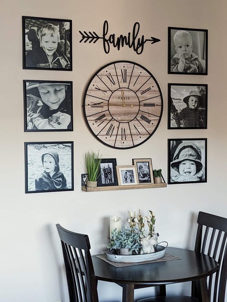 a dining room table with four chairs and a clock on the wall above it that says family