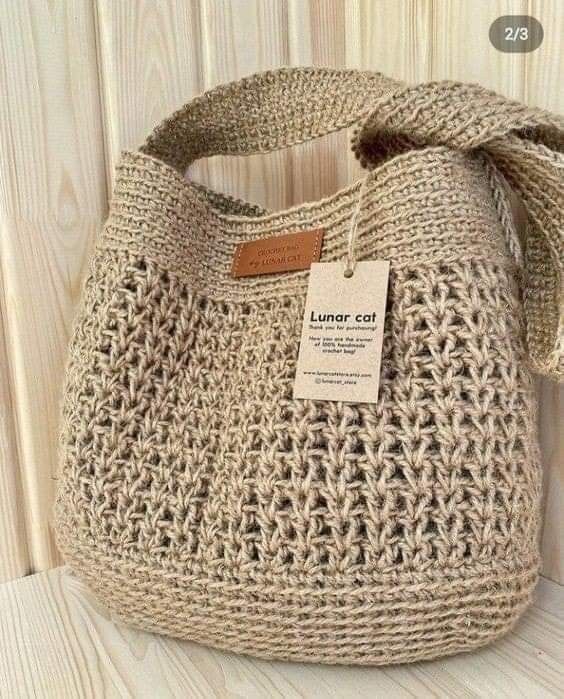 a crocheted bag with a tag on it